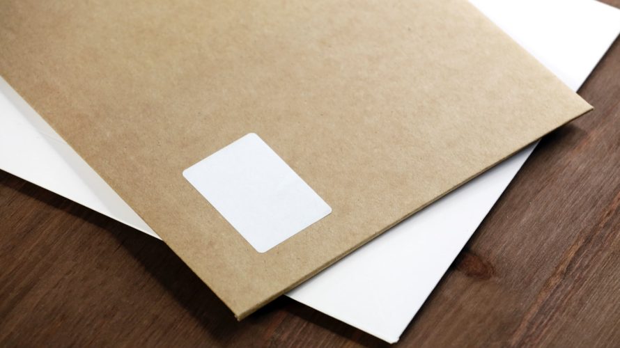 white paper on brown wooden table